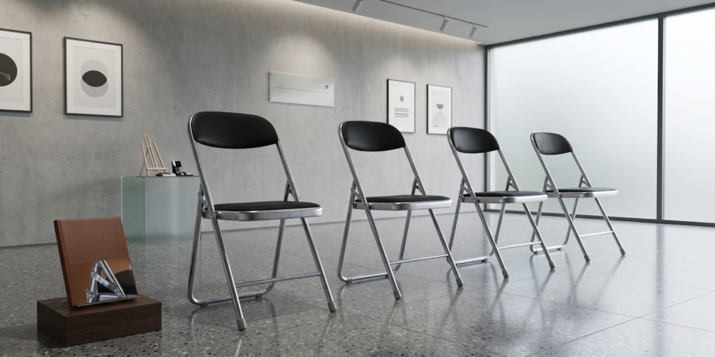 4 folding chairs in display on a display room